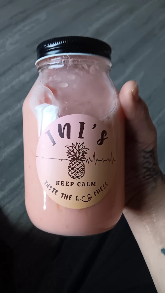Pineapple smoothie in a glass Ini's jar